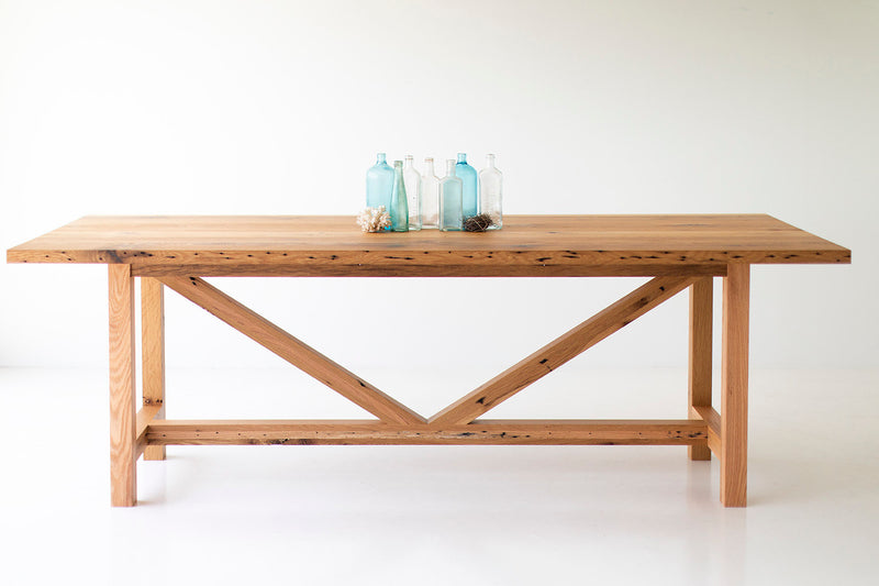 Angled view of the modern luxury solid oak farmhouse dining table