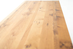 Close-up of the tabletop edge on the modern luxury oak farmhouse table