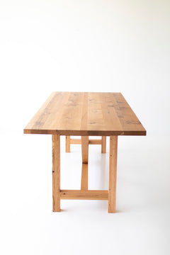 Modern luxury oak farmhouse table styled as a statement desk