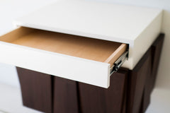 Craft Associates floating nightstand showing walnut cabinet door