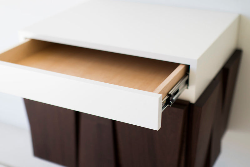 Craft Associates floating nightstand showing walnut cabinet door