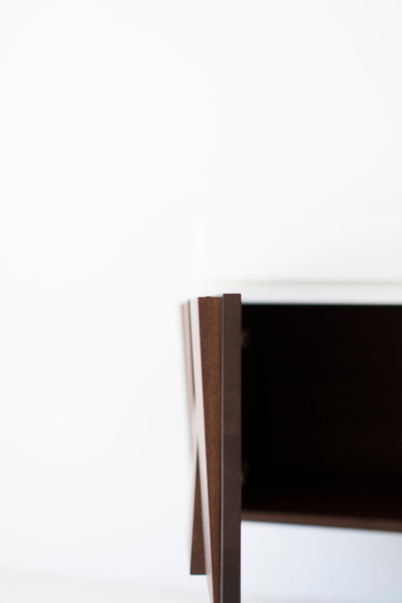 Floating nightstand styled in a mid-century bedroom setting