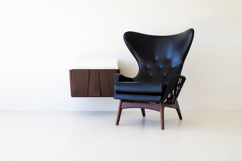 Floating nightstand shown mounted on a wall