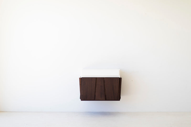Close-up of the matte finish on the floating walnut nightstand