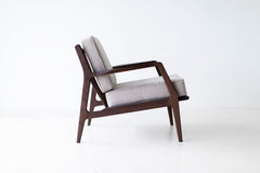 Angled view of the Lawrence Peabody walnut lounge chair