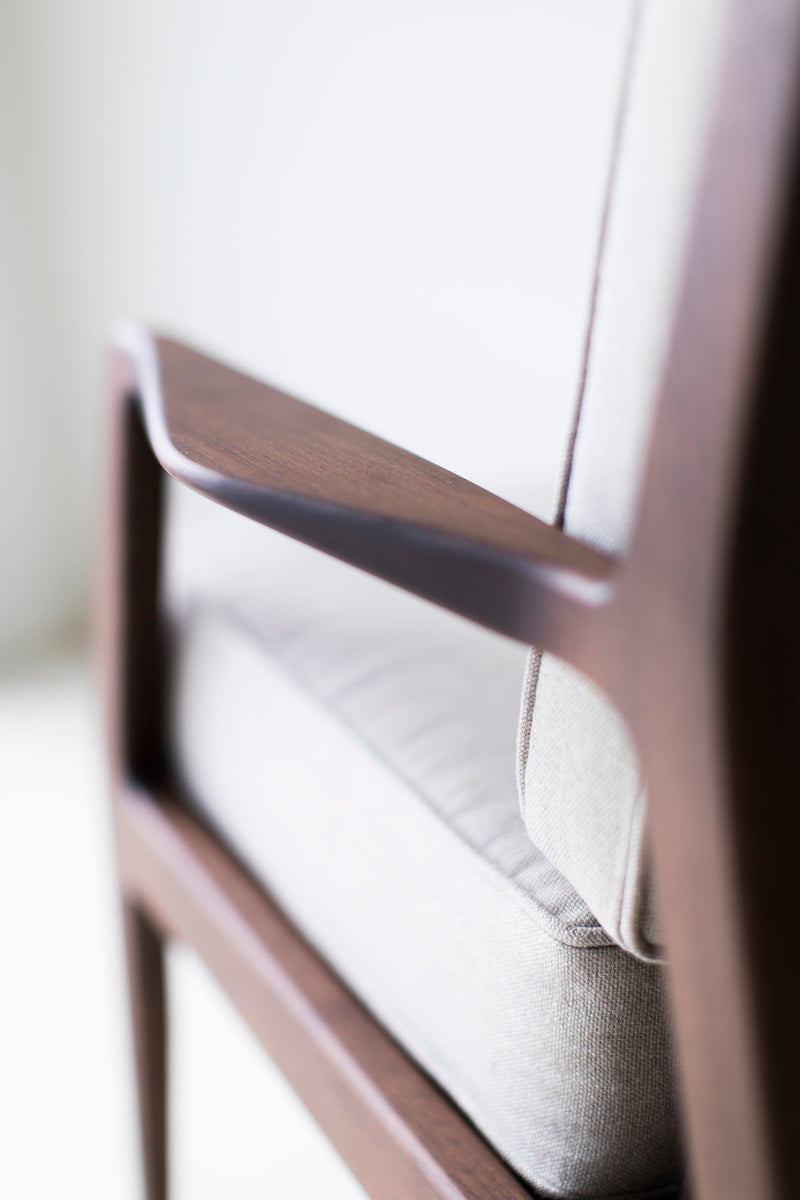 Detail of the walnut wood grain on the lounge chair frame