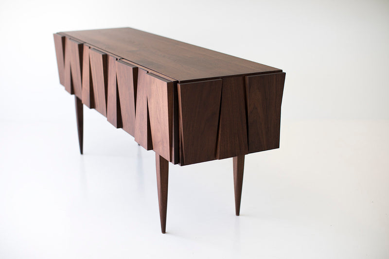 Craft Associates modern console showing walnut cabinet doors