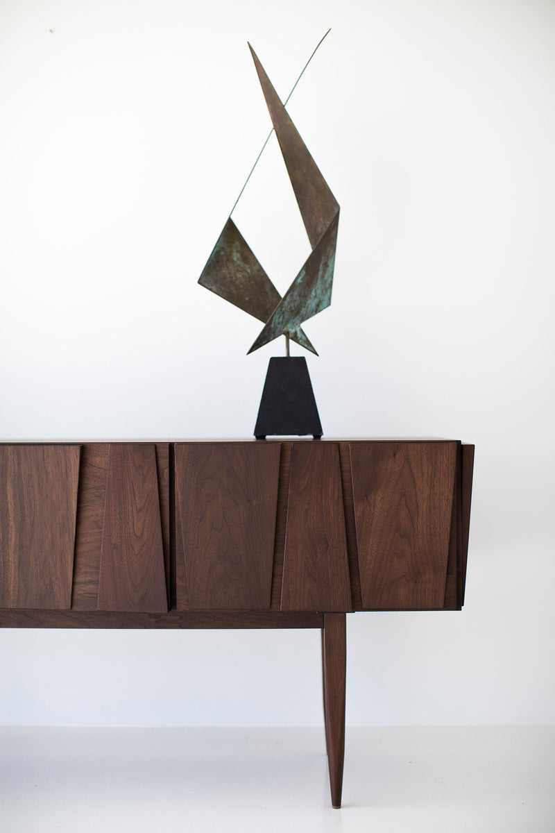 Modern console shown with cabinet doors open