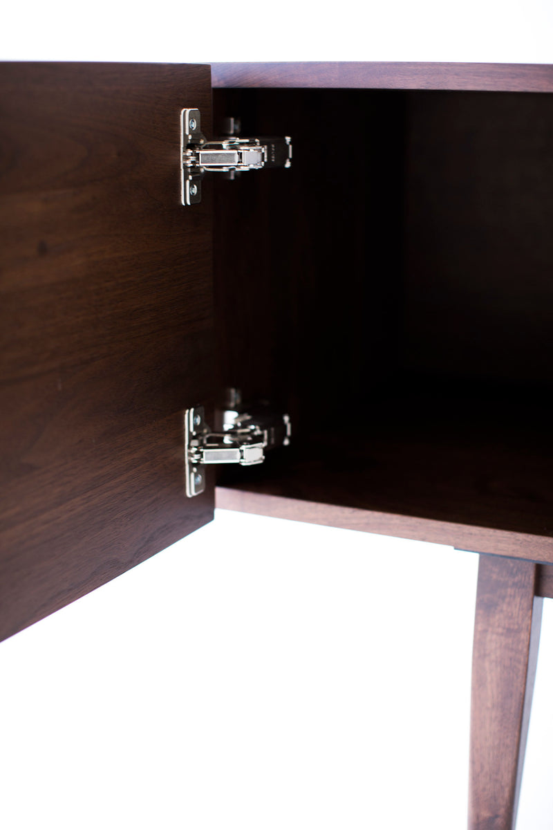 Close-up of the matte finish on the walnut console