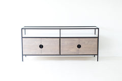Angled view of the modern luxury weathered pine credenza with glass display top