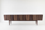 Craft Associates modern credenza showing walnut cabinet doors