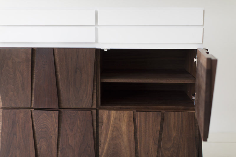 Modern dresser styled in a mid-century bedroom setting