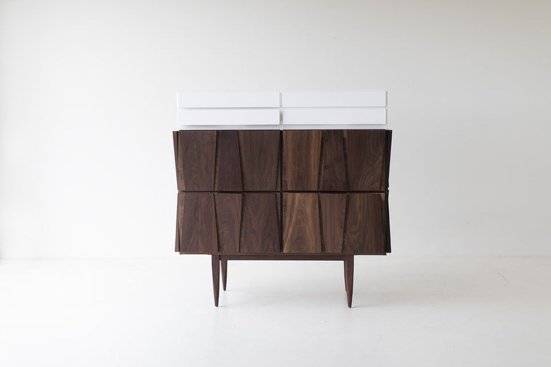 Close-up of the hand-finished walnut base on the dresser