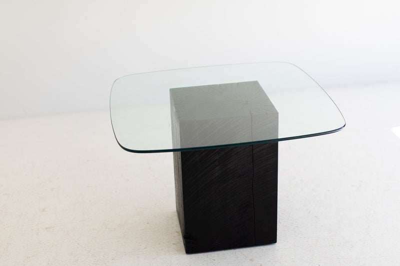 Modern glass-top coffee table shown from above