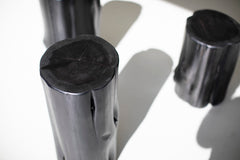 Black stump used as a low stool