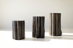 Natural cracking and grain visible beneath the black finish
