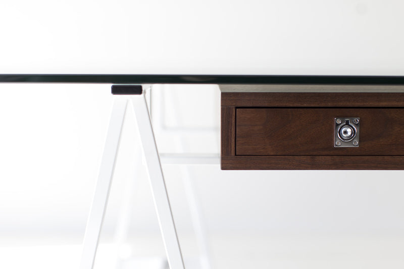 Close-up of the steel and walnut detail on the modern luxury desk
