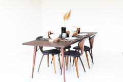 Modern luxury New York table showing solid black walnut construction