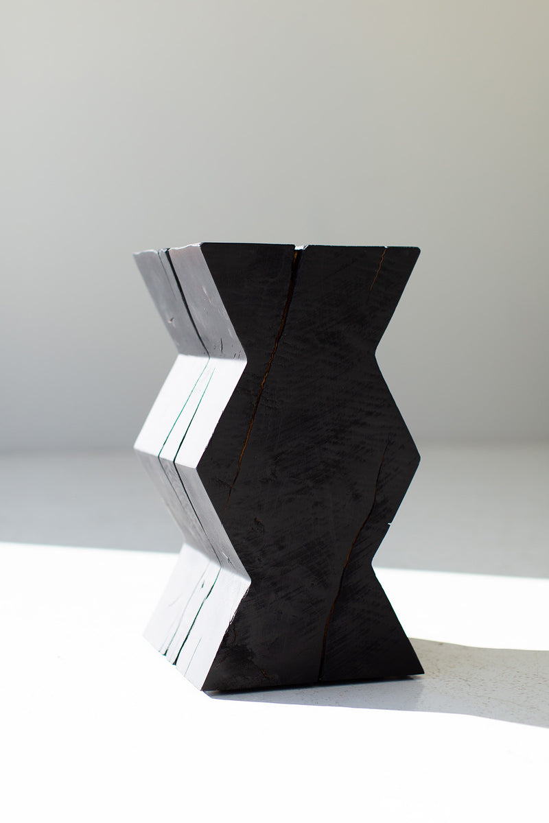 Zig zag end table styled in a bright interior